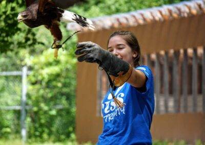 Student Catching Falcon at Trinity