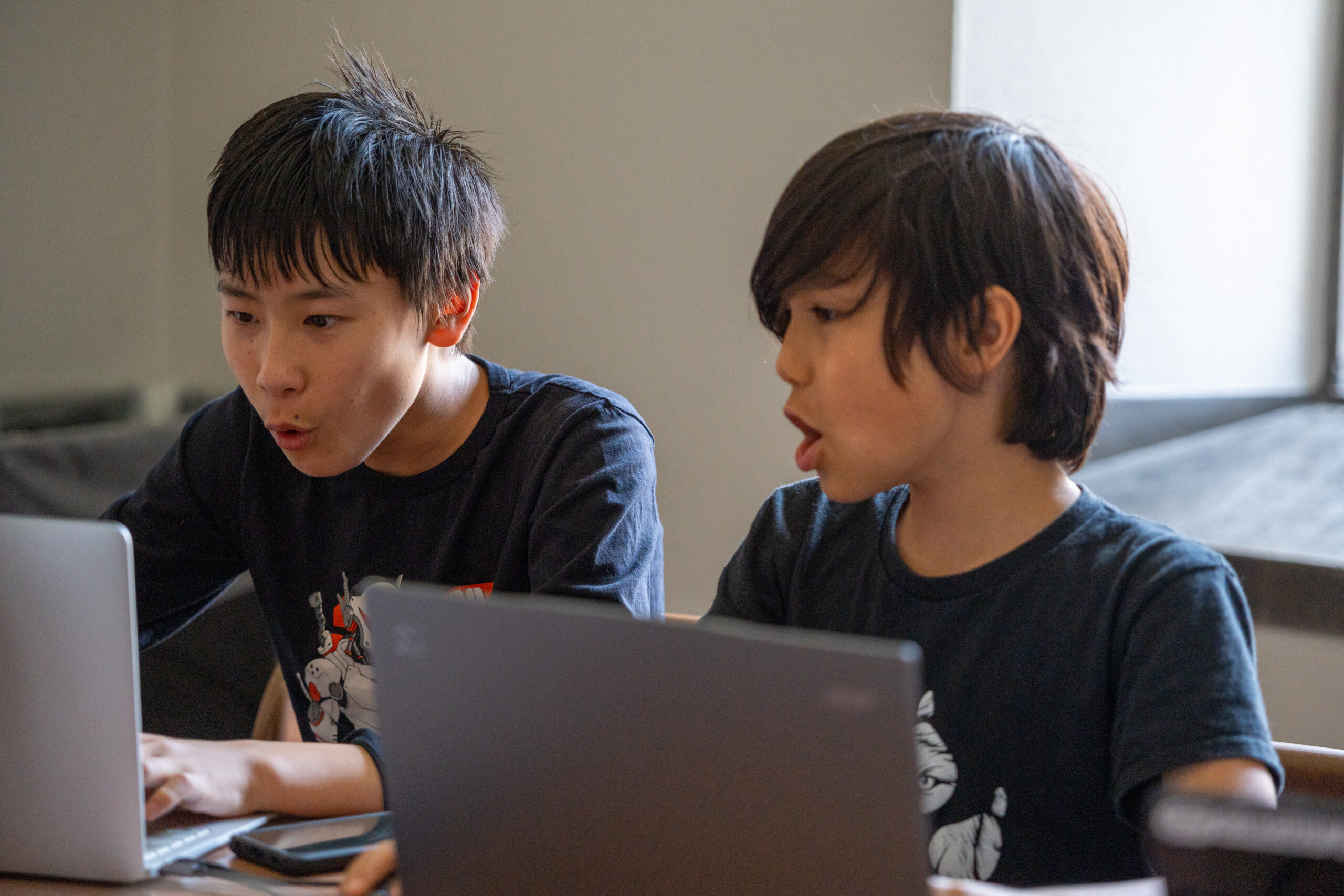 Many students posing in front of a regal building